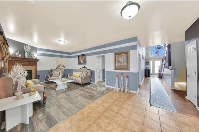 26800 Basswood Cir, Plainfield, IL 60585 - interior space featuring light tile patterned floors, a fireplace, and baseboards