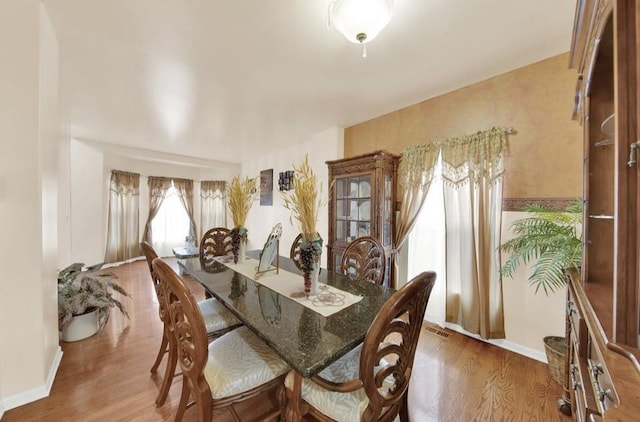 26800 Basswood Cir, Plainfield, IL 60585 - dining area featuring baseboards and wood finished floors