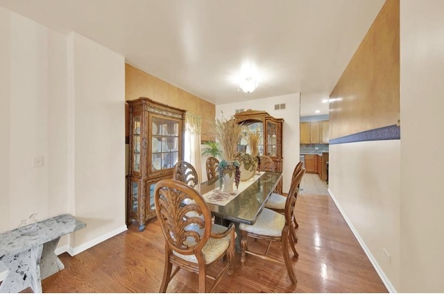 26800 Basswood Cir, Plainfield, IL 60585 - dining space with visible vents, baseboards, and light wood-type flooring