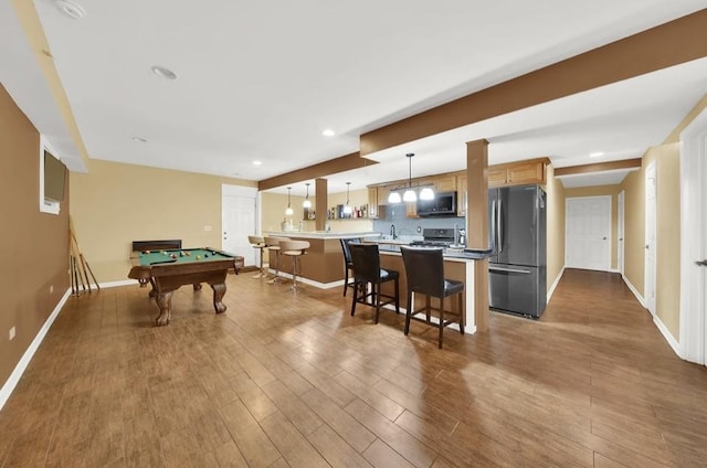 26800 Basswood Cir, Plainfield, IL 60585 - recreation room with recessed lighting, baseboards, and dark wood-style flooring
