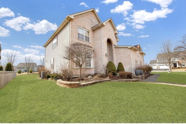 26800 Basswood Cir, Plainfield, IL 60585 - traditional-style home featuring a front yard and brick siding