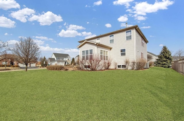 26800 Basswood Cir, Plainfield, IL 60585 - back of house featuring a lawn and fence