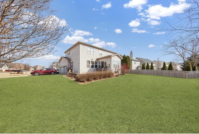 26800 Basswood Cir, Plainfield, IL 60585 - view of yard featuring a garage, a sunroom, and fence