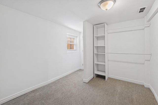 spacious closet featuring visible vents and carpet flooring