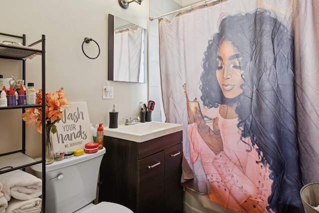 bathroom with toilet, vanity, and shower / tub combo