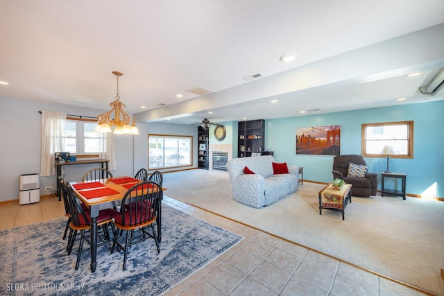 carpeted dining space featuring tile patterned flooring, visible vents, baseboards, a chandelier, and recessed lighting