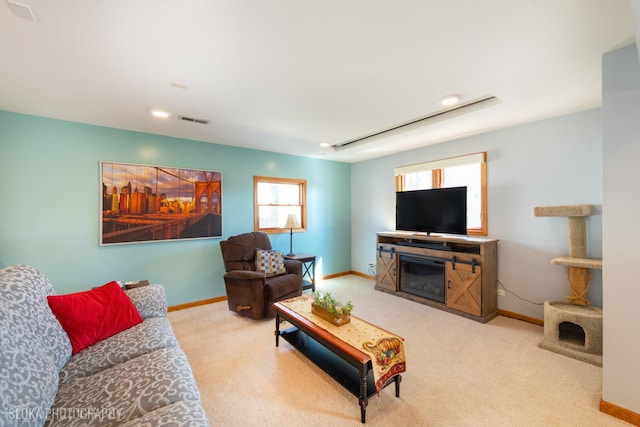 living room featuring baseboards, visible vents, and carpet floors