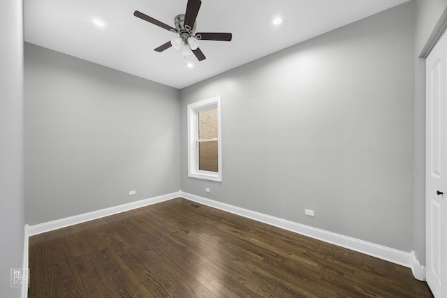 spare room featuring ceiling fan, dark wood-type flooring, recessed lighting, and baseboards