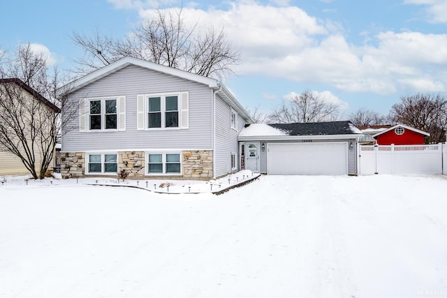 split level home with fence