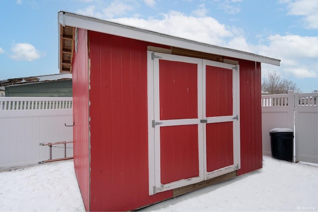 view of shed with fence