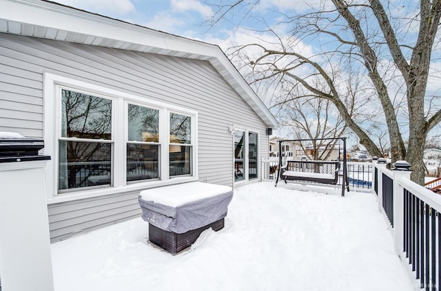 view of snow covered deck