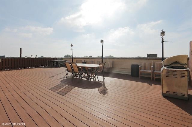 deck with outdoor dining area