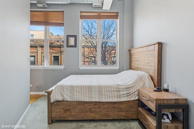 bedroom featuring baseboards and carpet floors