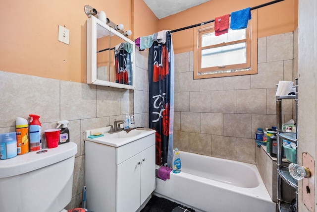 full bath with toilet, vanity, tile walls, decorative backsplash, and shower / bath combo with shower curtain