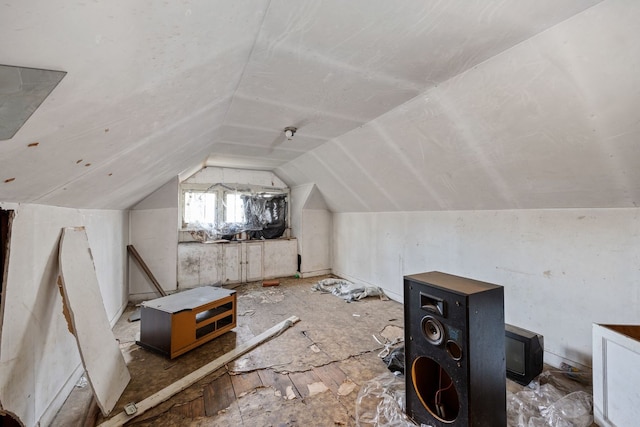 additional living space featuring vaulted ceiling