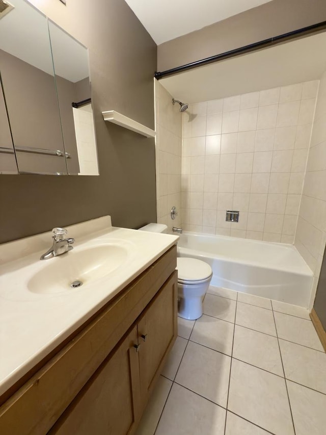 full bath with tile patterned floors, washtub / shower combination, toilet, and vanity
