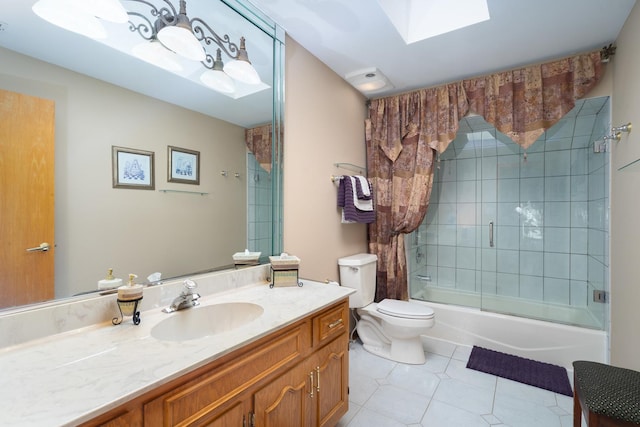 full bathroom with bath / shower combo with glass door, toilet, a skylight, tile patterned floors, and vanity