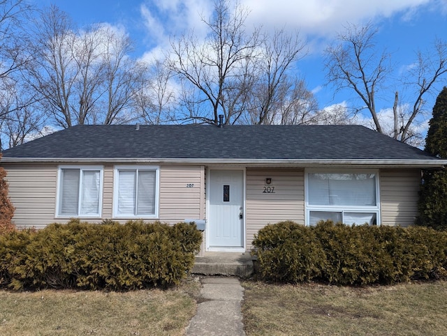 view of front of property with roof with shingles