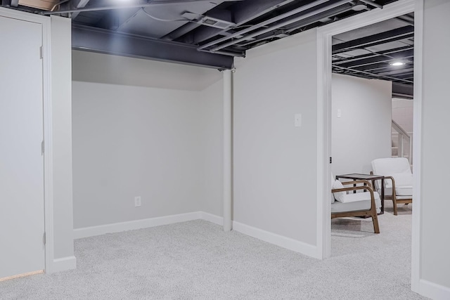 finished basement with carpet flooring and baseboards