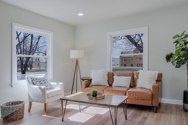 living room with recessed lighting, wood finished floors, and baseboards