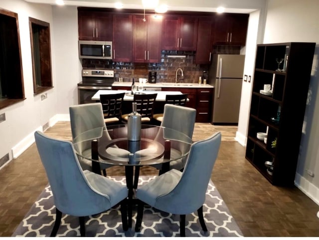 dining area featuring baseboards