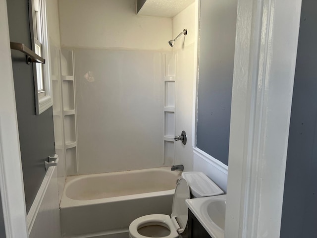 full bath featuring tub / shower combination, toilet, and vanity