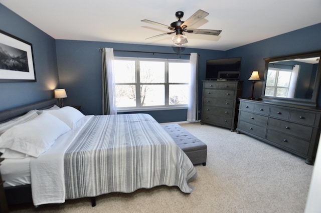 bedroom with carpet and a ceiling fan