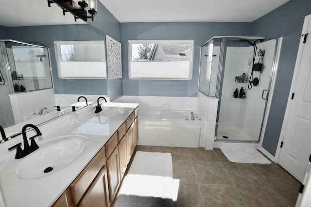 bathroom with a garden tub, a sink, and a shower stall