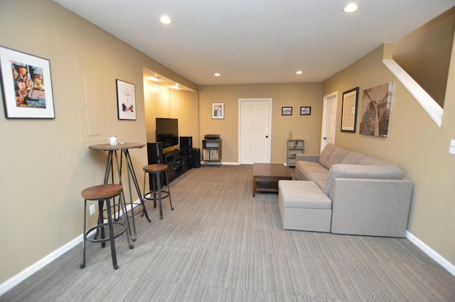 living area with baseboards, carpet flooring, and recessed lighting