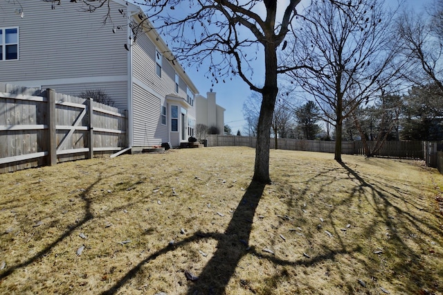 view of yard with a fenced backyard