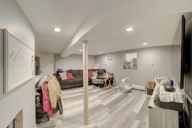 interior space with light wood finished floors, baseboards, and recessed lighting