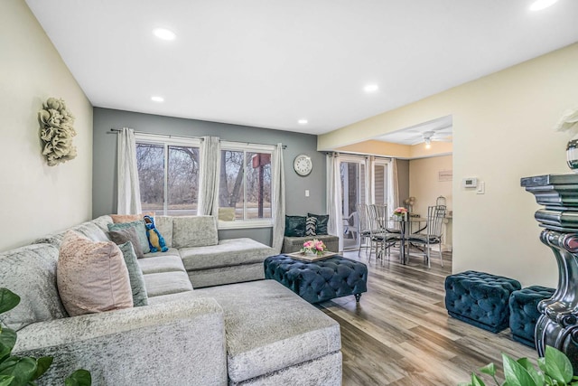 living area with recessed lighting and wood finished floors