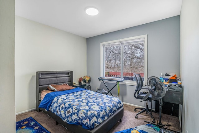 carpeted bedroom with baseboards