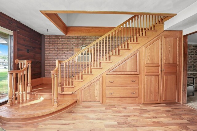 living area featuring light wood finished floors, a fireplace, and baseboards