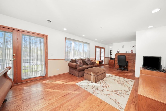 living room featuring light wood-style floors, recessed lighting, and a desk