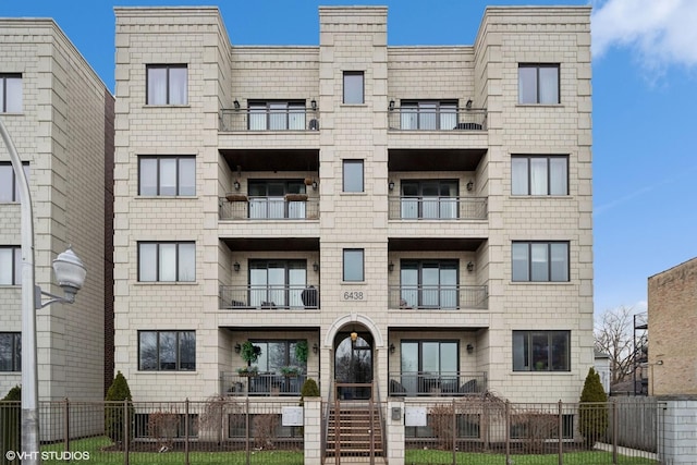 view of building exterior featuring a fenced front yard