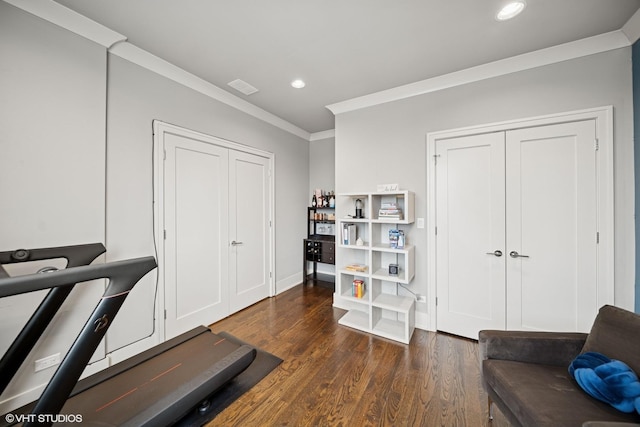 workout area with recessed lighting, visible vents, baseboards, ornamental molding, and dark wood-style floors