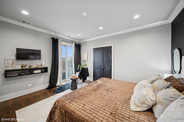 bedroom featuring baseboards, visible vents, ornamental molding, wood finished floors, and access to outside