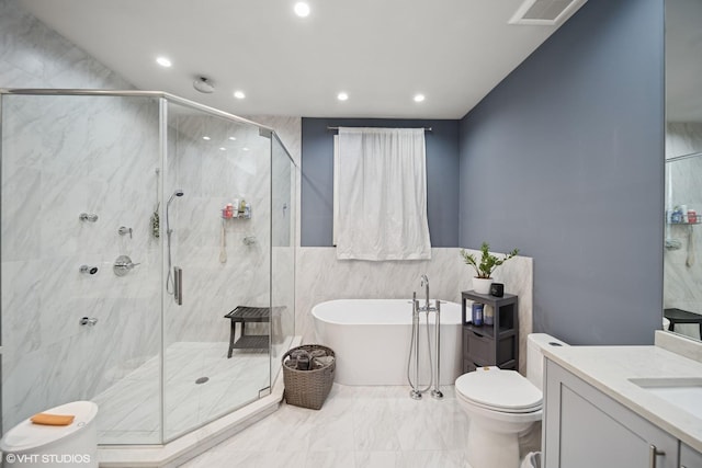 full bath featuring a freestanding tub, recessed lighting, vanity, visible vents, and a shower stall