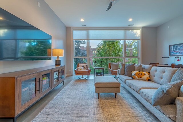 living area with recessed lighting, floor to ceiling windows, and visible vents