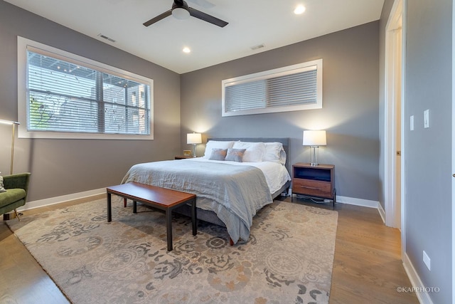 bedroom featuring recessed lighting, visible vents, baseboards, and wood finished floors