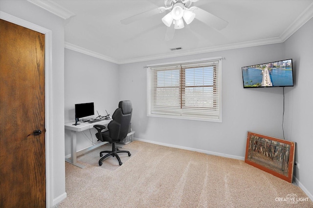 carpeted home office featuring a ceiling fan, baseboards, visible vents, and ornamental molding