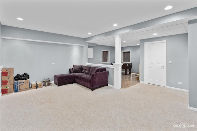 living area with recessed lighting, baseboards, light carpet, and a drop ceiling