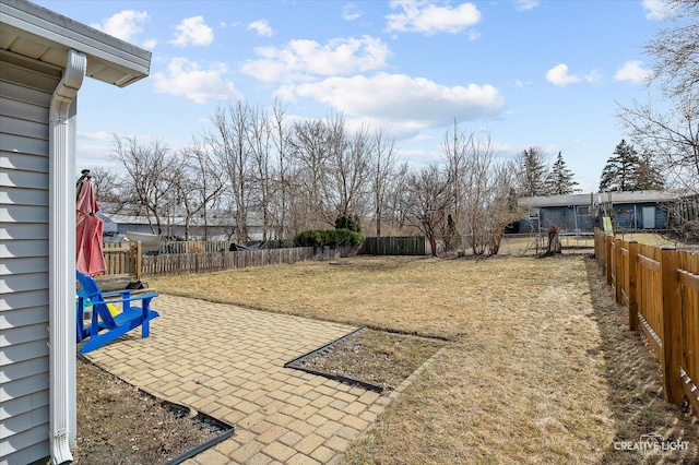 view of yard with a patio and a fenced backyard