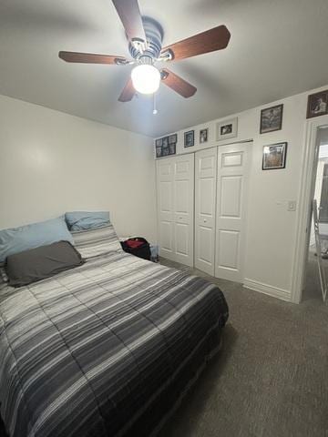 bedroom with ceiling fan, carpet, a closet, and baseboards