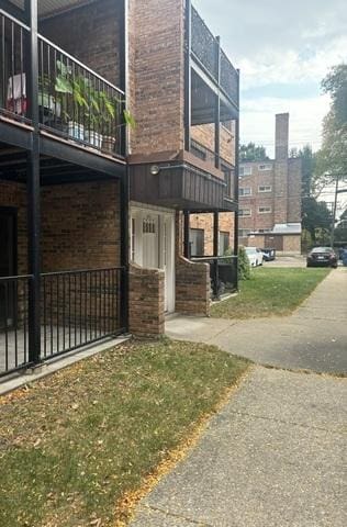 view of property exterior featuring brick siding