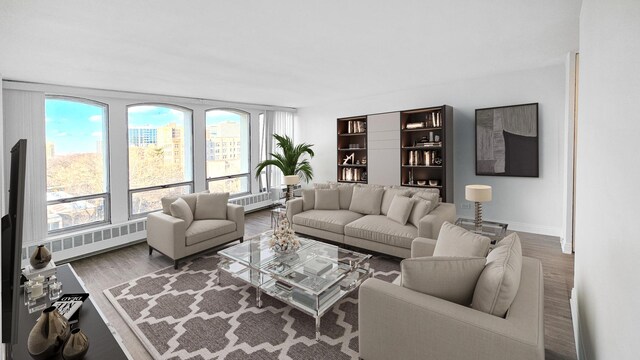 living area with dark wood-style floors and baseboards