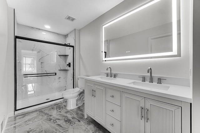 bathroom with marble finish floor, visible vents, a sink, and toilet