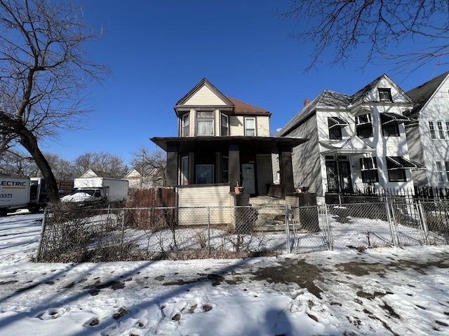 view of front of house with a porch, a fenced front yard, and a gate