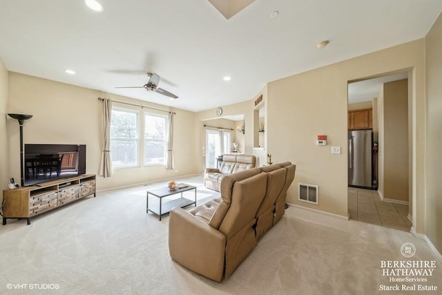 living room featuring visible vents, light carpet, a ceiling fan, recessed lighting, and baseboards